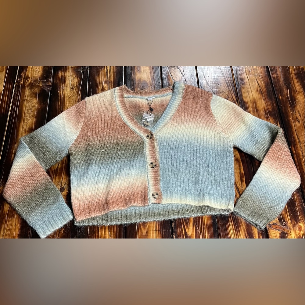 Multicolored v-neck button up sweater.